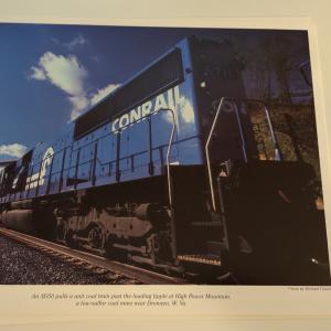 Promotional photo: An SD50 pulls a unit coal train past the loading tipple at High Power Mountain, a low-sulfur coal mine near Drennen, W.Va.