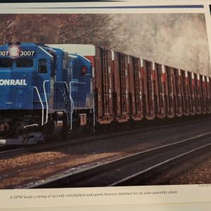 Promotional photo: A GP40 leads a string of recently refurbished auto-parts boxcars destined for an auto assembly plant.