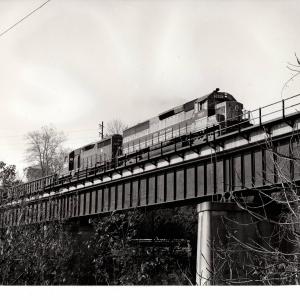 Photograph of SD45-2 3667 and GP35 2267 on train HB-8 at Reading PA. 10/22/76