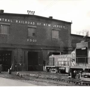Photograph of unknown RS11 and former LV RS3 at E Port Shops. 10/31/76