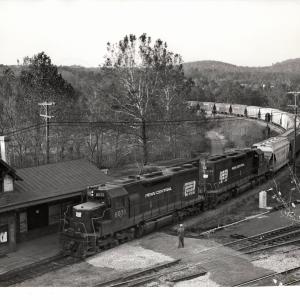 Photograph of SD35 6038 and SD40 6054 on a grain train coming off the Belt Line in Birdsboro PA. 10/22/76