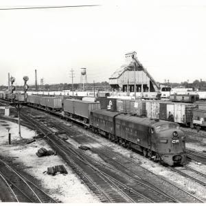 Photograph of FP7 4360 and F7 4345 in Collinwood Yard, Cleveland OH. Also shows N7E caboose 21143. 7/24/77.