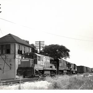 Photograph of U25B 2529 and two more units on train MC97 at RU Tower in Sterling OH. 7/24/77