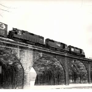 Photograph of GP35 2349, GP38 8108 and a borrowed Missouri Pacific GP35 crossing Rockville Bridge. 1/8/77