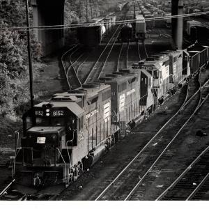 Photograph of GP38-2 8152, GP35 2351, GP35 3615 and another unknown GP unit leaving Enola Yard westbound. 6/76