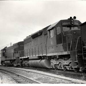 Photograph of SD40 3064 and U23B 2721 leaving Hagerstown Yard. 5/76