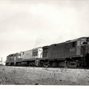 Photograph of C424 2454, U28C 6304 and an unknow GP38-2 at Orrville OH. 7/30/76