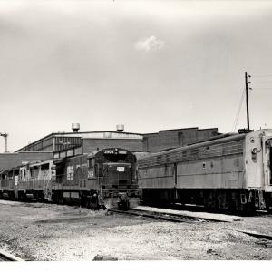 Photograph of U30B 2904, GP30 3607 and other locomotives at the Harrisburg Engine Shops. 7/76