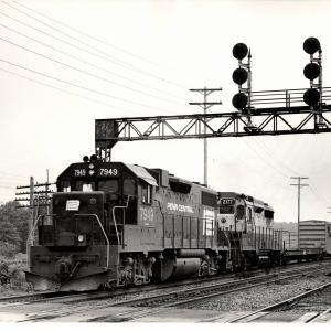 Photograph of GP38-2 7949 and GP30 2177 eastbound out of Cleveland. 7/31/76