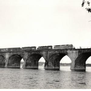 Photograph of SDP45 3645, a GP40 and SD45 6142 crossing Rockville Bridge. 5/76