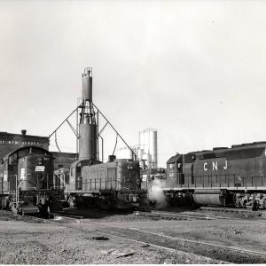 Photograph of RS1 9915, RS3 1563 and GP40P 3683 at E Port engine terminal. 12/5/76