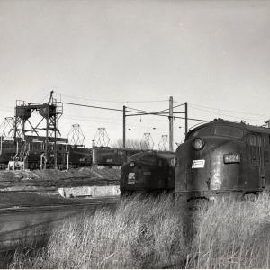 Photograph of E7 4224, E8 4324, GG1 4881 and GG1 4882 at South Amboy NJ. 12/5/76.