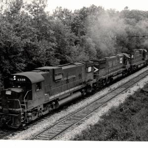 Photograph of C630 6328, C628 629 and C630 6338 on an ore train at Ravenna OH. 7/30/76