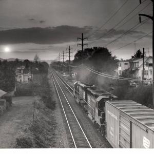 Photograph of GP40 3164 and an unknown SD45 westbound out of Reading. 10/21/76