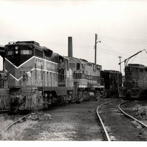Photograph of BAR GP7 68 and C424 2414 and a GP18 at East 55th St Yard in Cleveland OH. 7/31/76