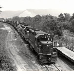 Photograph of GP38-2 7745, SD45 6077 and eight more units entering Enola Yard. 7/10/77