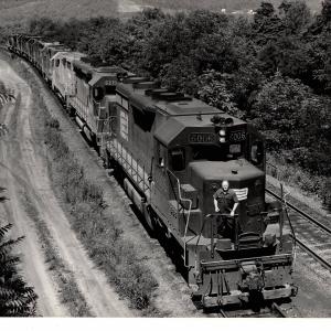 Photograph of SD35 6006, SD45 6219 and a number of other units entering Enola Yard. 7/76