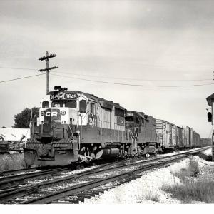 Photograph of GP35 3649 and GP38-2 7968 on train CM96 at Sterling OH. 7/24/77