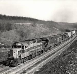 Photograph of GP35 2573, GP38-2 8005 and two more units on TV79 at Tunnel Hill PA. 2/8/77