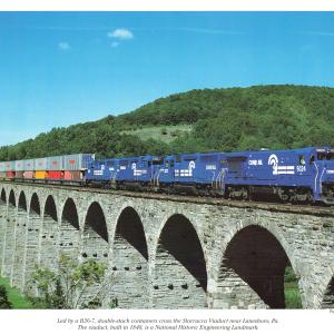 Promotional photo: Led by a B36-7, double-stack containers cross the Starrucca Viaduct near Lanesboro, Pa. The viaduct, built in 1848, is a National Historic Engineering Landmark.