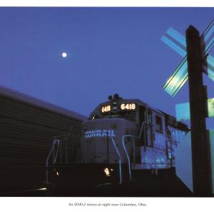 Promotional photo: An SD40-2 moves at night near Columbus, Ohio.