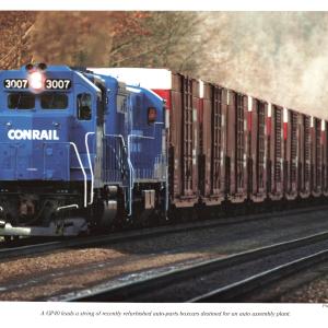 Promotional photo: A GP40 leads a string of recently refurbished auto-parts boxcars destined for an auto assembly plant.