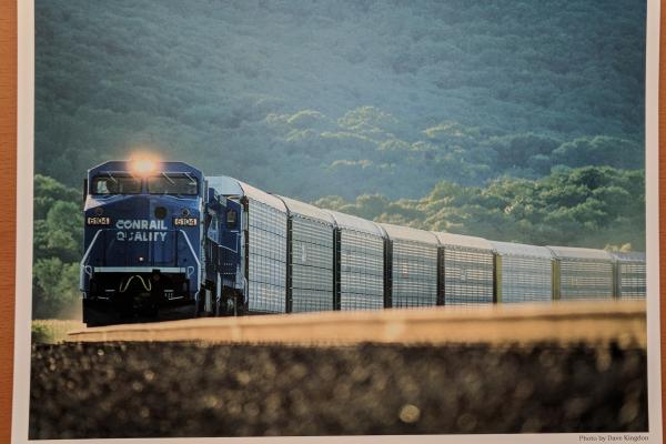 Promotional photo: A string of multilevel automobile carriers traverses Conrail's River Line near Iona Island and Bear Mountain, N.Y.