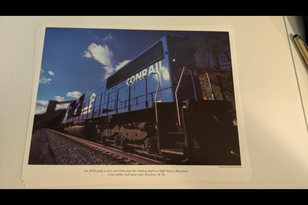 Promotional photo: An SD50 pulls a unit coal train past the loading tipple at High Power Mountain, a low-sulfur coal mine near Drennen, W.Va.