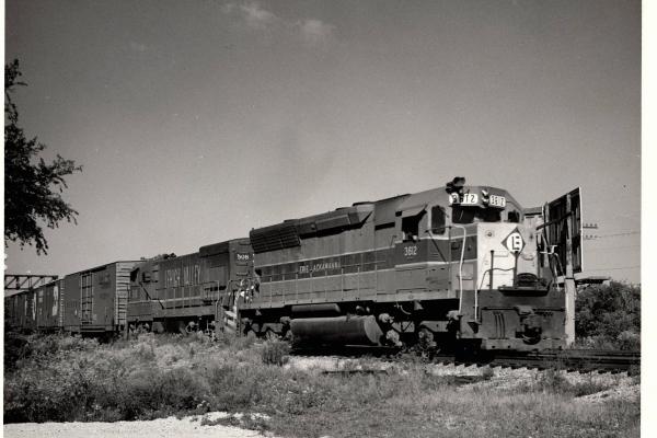 Photograph showing SD45 3612 and U23B 508 eastbound at Elkhart Indiana. 8/29/76.