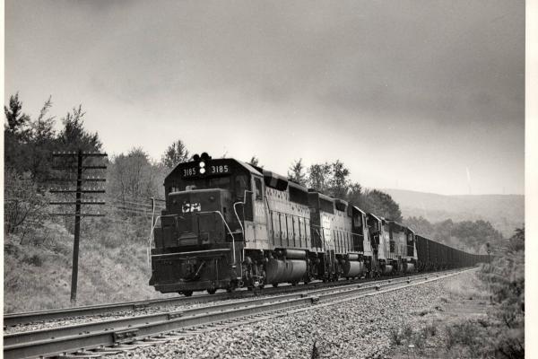 Photograph showing GP40 3185 leading a coal train at Scranton PA. 9/26/76