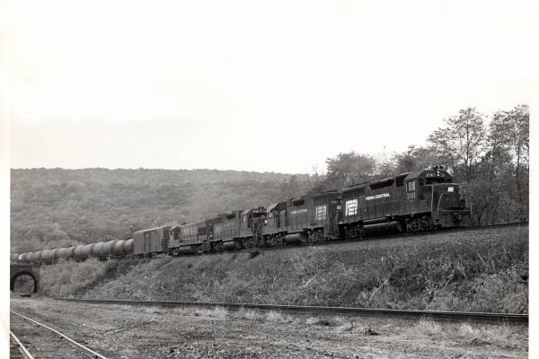 Photograph of GP40 3131, GP38-2 7997, GP38 7743, and U23B 501 at Marysville PA. 11/16/76