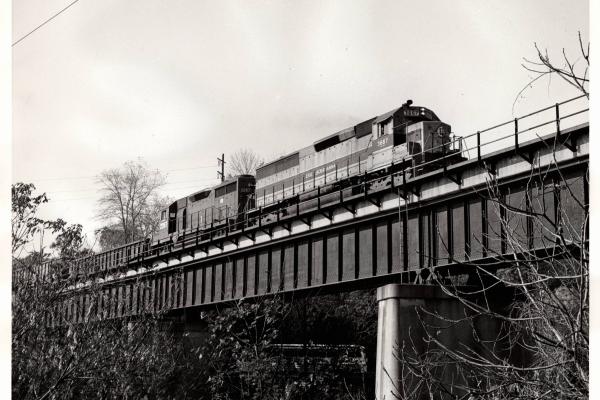 Photograph of SD45-2 3667 and GP35 2267 on train HB-8 at Reading PA. 10/22/76