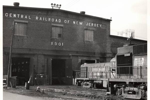 Photograph of unknown RS11 and former LV RS3 at E Port Shops. 10/31/76