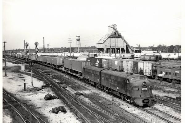 Photograph of FP7 4360 and F7 4345 in Collinwood Yard, Cleveland OH. Also shows N7E caboose 21143. 7/24/77.