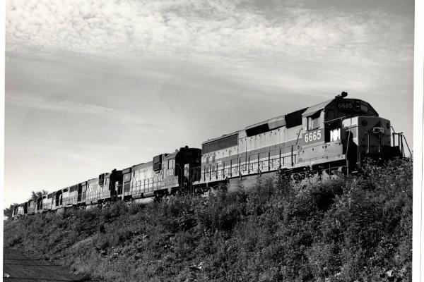 Photograph of SD45-2 6665, C630 6755 and others at Hudson OH. 7/23/77