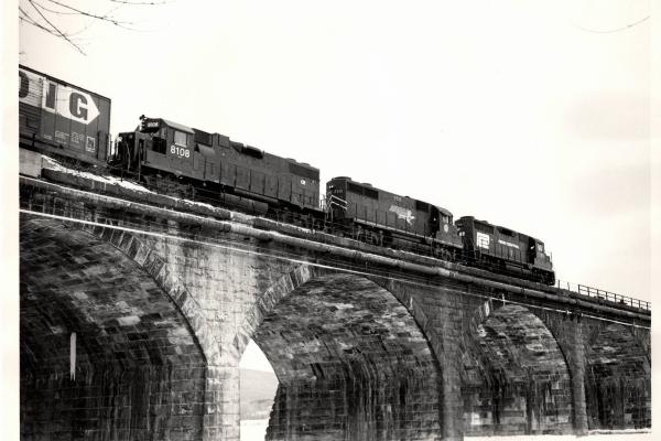 Photograph of GP35 2349, GP38 8108 and a borrowed Missouri Pacific GP35 crossing Rockville Bridge. 1/8/77