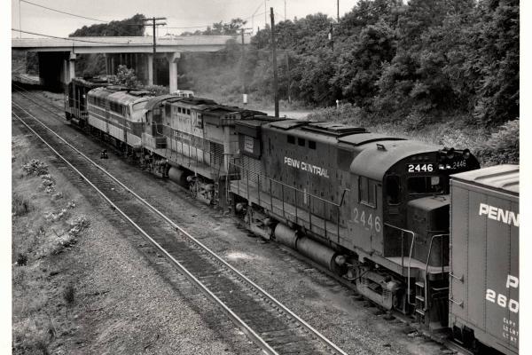 Photograph of C424 2446, C424 2408 and an unknown E8 and GP30 entering Enola Yard. 7/76