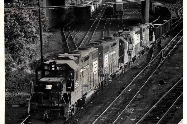 Photograph of GP38-2 8152, GP35 2351, GP35 3615 and another unknown GP unit leaving Enola Yard westbound. 6/76