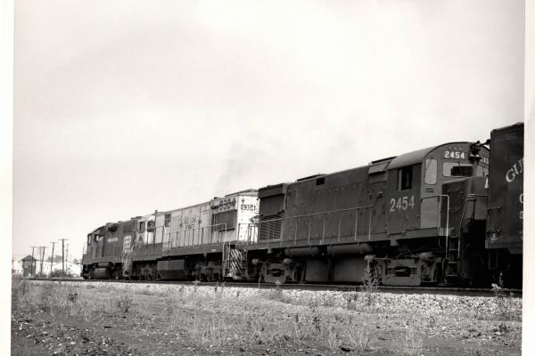 Photograph of C424 2454, U28C 6304 and an unknow GP38-2 at Orrville OH. 7/30/76