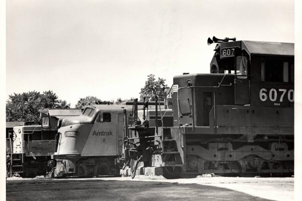 Photograph of SD40 6070 and other units at Harrisburg PA. 7/76