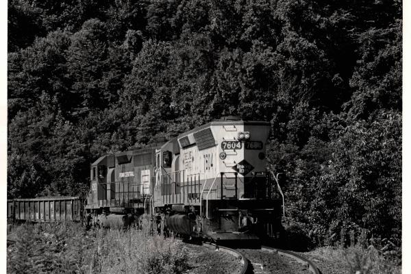 Photograph of SD45 7604 and SD40 6282 at Rockville Bridge. 7/76
