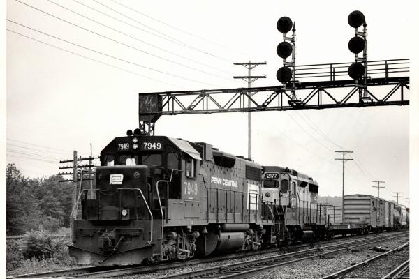 Photograph of GP38-2 7949 and GP30 2177 eastbound out of Cleveland. 7/31/76