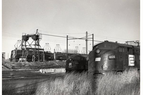 Photograph of E7 4224, E8 4324, GG1 4881 and GG1 4882 at South Amboy NJ. 12/5/76.