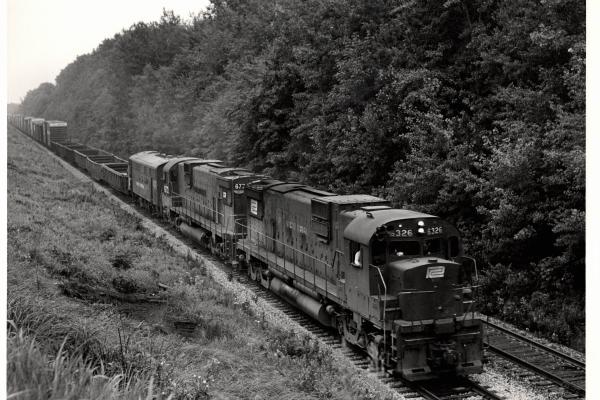 Photograph of C630 6326, another C630 and an F7 at Hudson OH. 7/30/76
