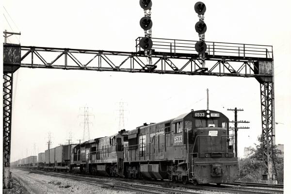Photograph of U28C 6533 U36C 3323 and an unknown SD40 in Cleveland OH. 7/76