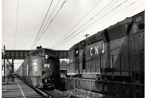 Photograph of GP40P 3674 and an unknown E8 at South Amboy NJ. 12/5/76