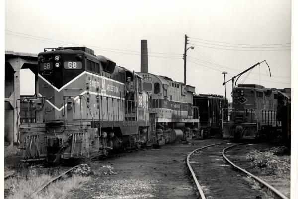 Photograph of BAR GP7 68 and C424 2414 and a GP18 at East 55th St Yard in Cleveland OH. 7/31/76