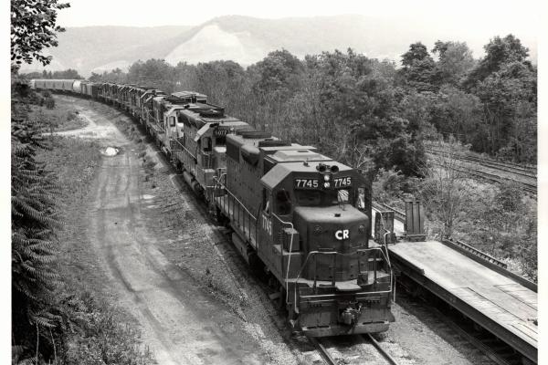 Photograph of GP38-2 7745, SD45 6077 and eight more units entering Enola Yard. 7/10/77