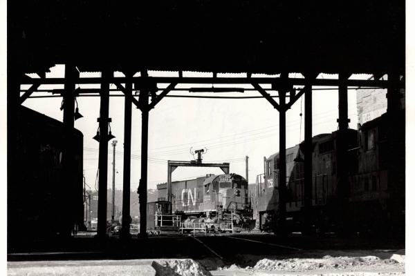 Photograph of leased CN C630 2333 and GP9 7256 at the Mingo Jct engine house. 5/14/77
