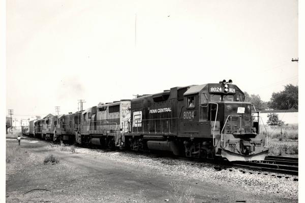 Photograph of GP38-2 8024, GP35 2578 and three more units at Orrville OH. 7/30/76